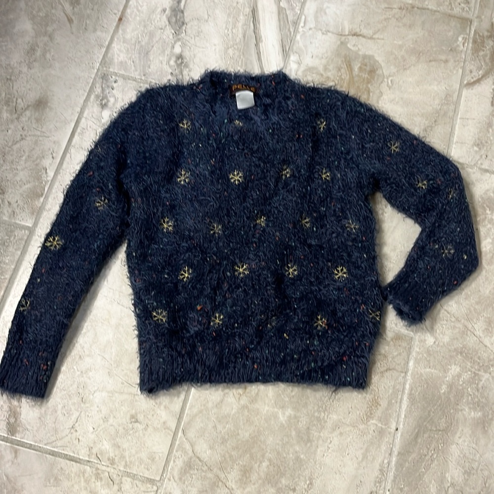 Pelle Italia sweater with gold snowflake stitching.